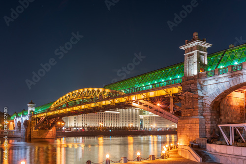 Pushkinskiy bridge with night illumination. Bridge to Gorky Park. photo