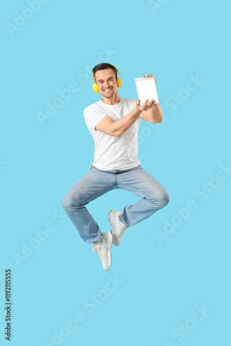 Jumping man with tablet com...