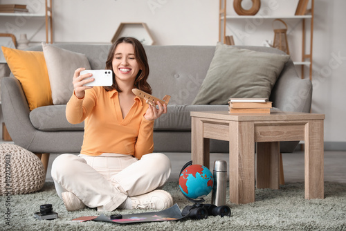 Female traveler at home. It...