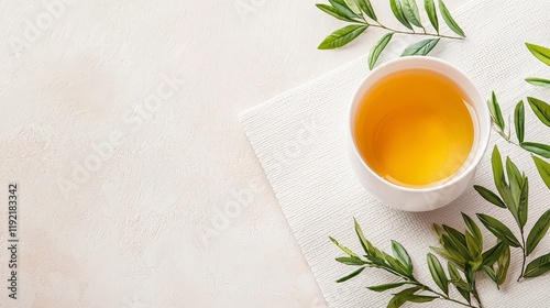 Wallpaper Mural Fresh Herbal Tea in a White Cup Surrounded by Green Leaves on a Light Background Torontodigital.ca