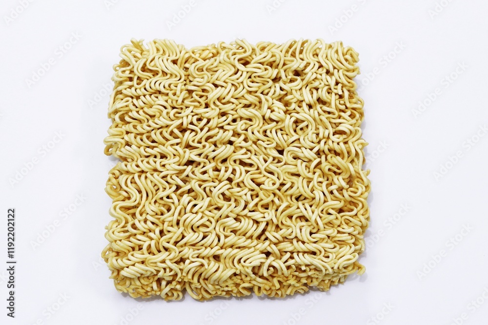 Dried instant noodle in typical block form, isolated Dried instant noodle in typical block form, isolated