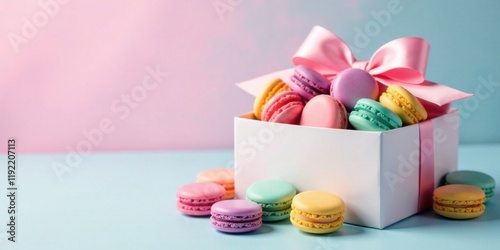Delightful pastel macarons in a pink ribboned gift box, a sweet treat for any occasion