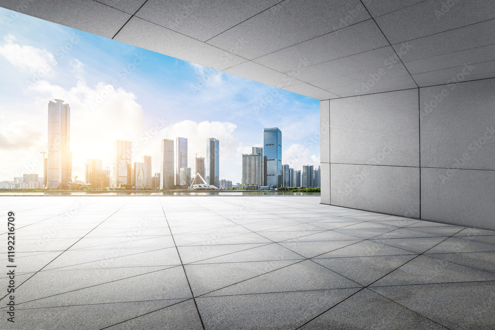 Empty square floor and modern city buildings on a sunny day