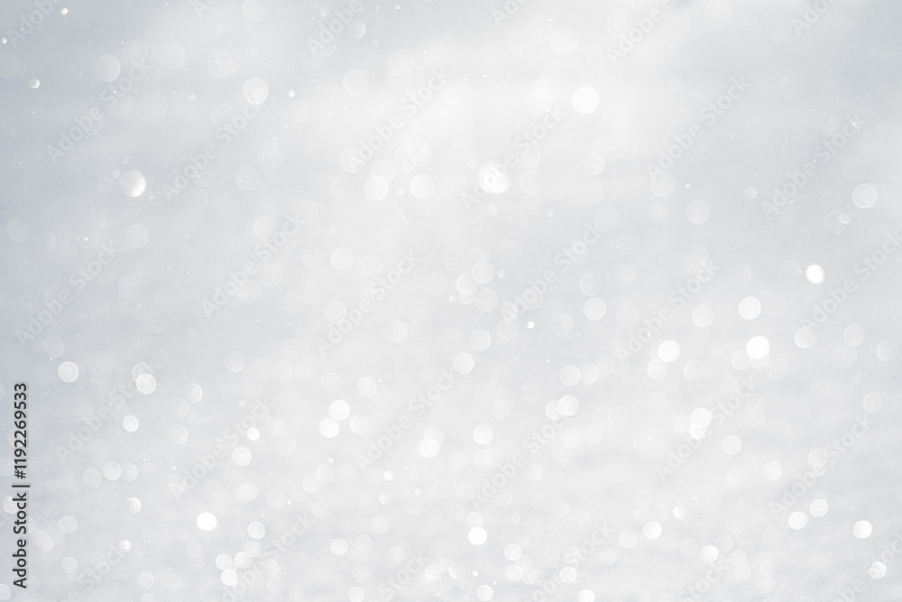 Blurred white bokeh background, snow sparkles in the sun Blurred white bokeh background, snow sparkles in the sun