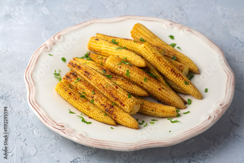 Roasted baby corn with various spices photo