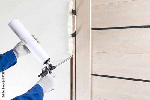 close-up of a can of foam, during work installing a door