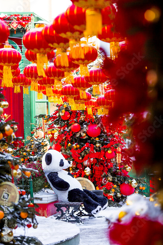 Plush stuffed pandas and Chinese red Christmas lanterns on Tverskaya Street in Moscow. Close-up. The first ever meeting of the Chinese New Year 2024 in Moscow. photo