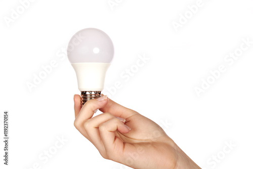 Female hand holding LED lamp with metal base on white background. photo