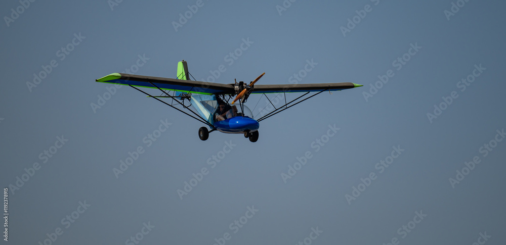 Ultralight aircraft or Microlight aircraft taking off on the runway in Hoedspruit South Africa