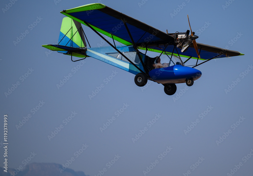 Ultralight aircraft or Microlight aircraft taking off on the runway in Hoedspruit South Africa