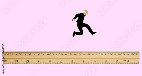 Concept illustration of an elderly man jumping over a ruler photo