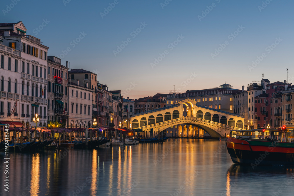 Venice's Canal Grande and Rialto Bridge at sunrise in Italy Venice's Canal Grande and Rialto Bridge at sunrise in Italy