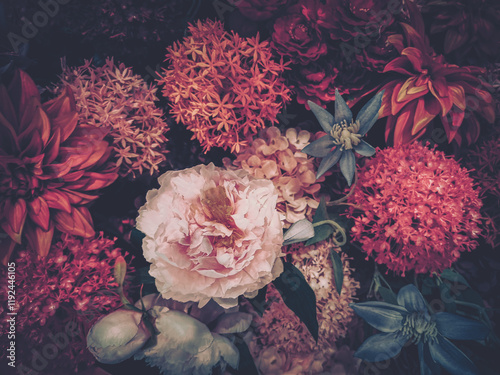 A vintage-styled image showcasing a rich arrangement of artificial flowers in deep reds and pinks, reminiscent of a Chinese New Year celebration.