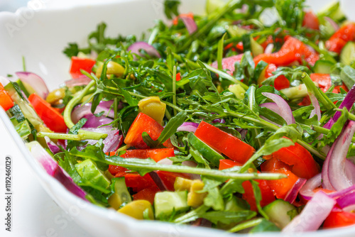 Food Concepts. Traditional Vegetable Mix Salad in Round Plate Over White Surface photo