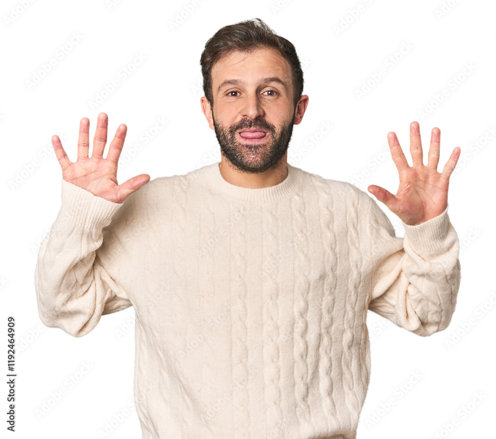 Fototapeta premium Studio portrait of young Hispanic male showing number ten with hands.