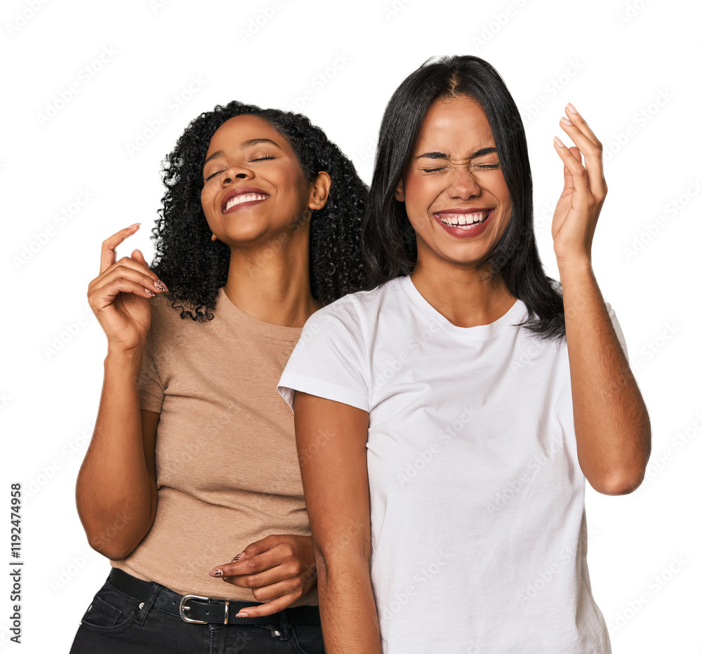 Young Latin friends in studio joyful laughing a lot. Happiness concept. Young Latin friends in studio joyful laughing a lot. Happiness concept.