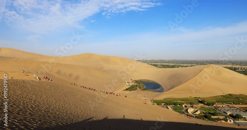 Dunhuang Crescent Spring and Singing Sand Mountain.It is located in the ring of the sand Mountain, because the shape of a curved crescent moon named. It is the first spring in the desert.