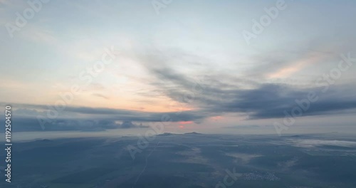 Beautiful sunrise sky above clouds with dramatic light. View from drone photo