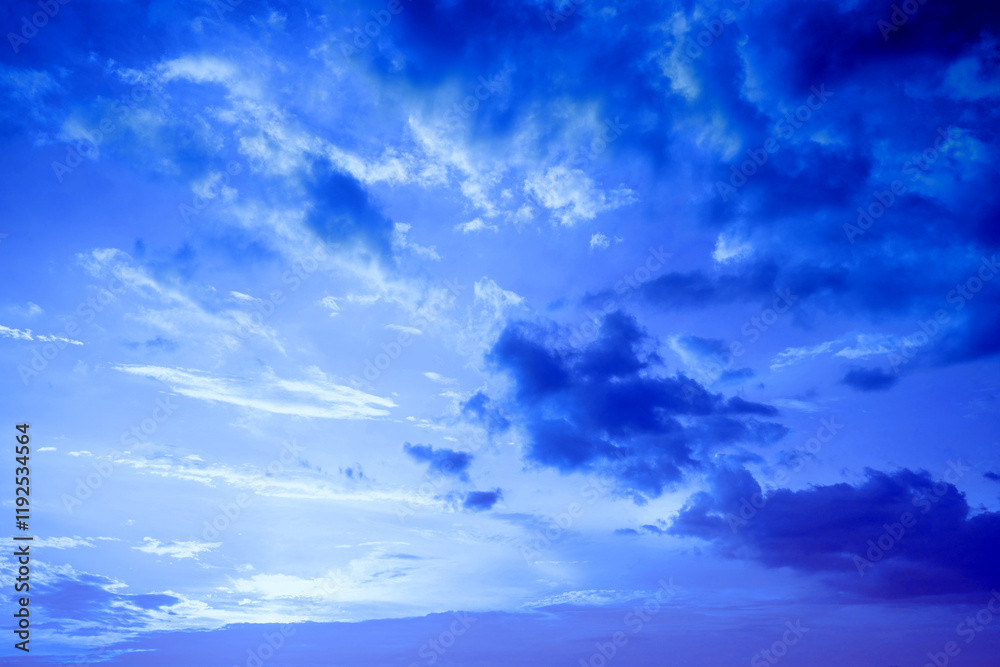Blue tint cloudy sky at sunset. Gradient color. Sky texture. Abstract natural background