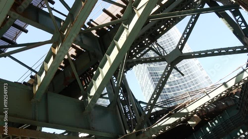 Wallpaper Mural New York elevated subway, metropolitan bridge, metro track above street. Railway transport over road. Old railroad line. Queens Plaza public transportation. Queensboro, Long Island city, United States Torontodigital.ca