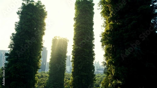 Lush tower covered with greenery filters polluted city air, releasing clean streams from its top. A vision of sustainable urban living through vertical forests