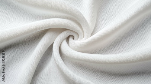 Soft white fabric twisted in a spiral, showcasing its texture and lightweight qualities, ideal for various textile applications.