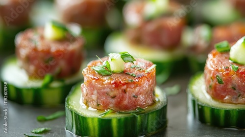 Fresh and flavorful cucumber canapÃ©s topped with savory sausage and herbs ideal for appetizers or party platters. photo