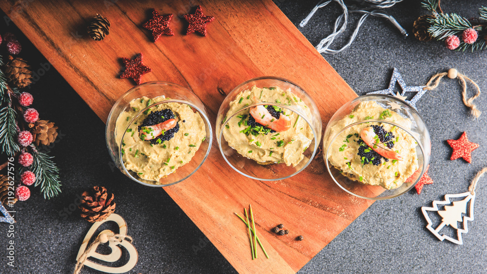 Verrine avocado shrimp pink fresh cheese guacamole chives cream lumpfish roe - decorated for Christmas