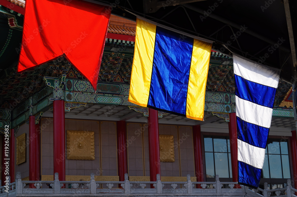 Close up shot of different country flags hanging near Chiang Kai-shek Memorial Hall