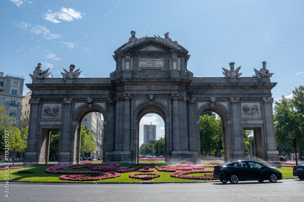 Obraz premium The Alcala Door (Puerta de Alcala) is a gate in the center of Madrid, Spain. It is the landmark of the city.
