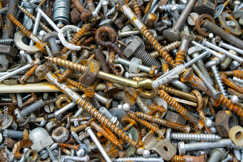 close up of old scrap iron nuts and bolts