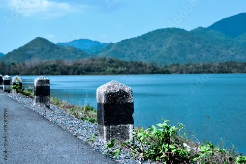 Asphalt road with natural view of Huai Prue Reservoir,Nakorn Nayok,Thailand photo