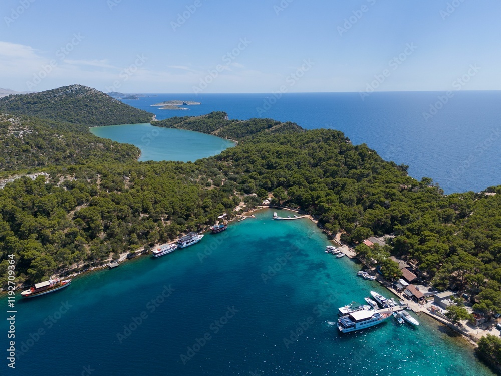 Aerial view of lush greenery and clear blue waters in Telascica Nature Park, Croatia