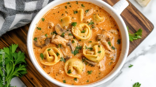 Creamy tomato tortellini soup with chicken and mushrooms
