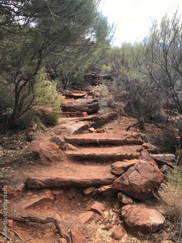 Rustic hiking trail with rocky steps in a dry landscape. Rustic hiking trail with rocky steps in a dry landscape.