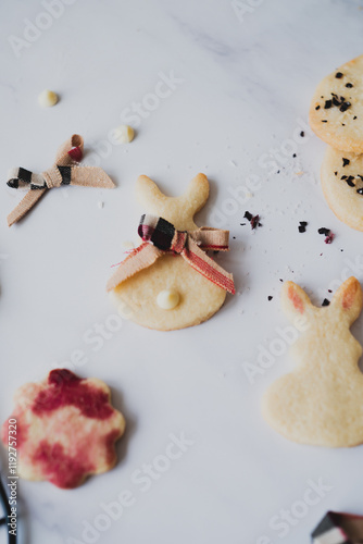 Top view of Easter bunny cookies with hibiscus tea staining photo