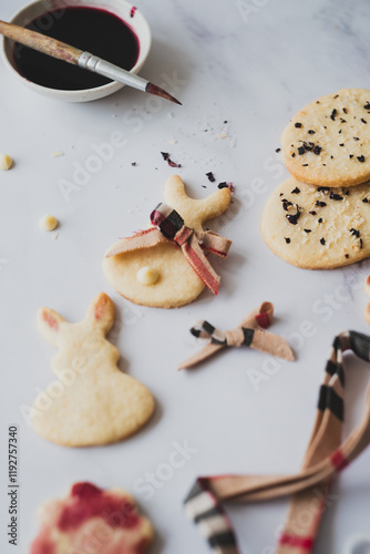 Easter bunny cookies painted with hibiscus tea, top view photo