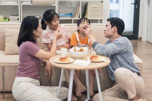 Young Asian family at home