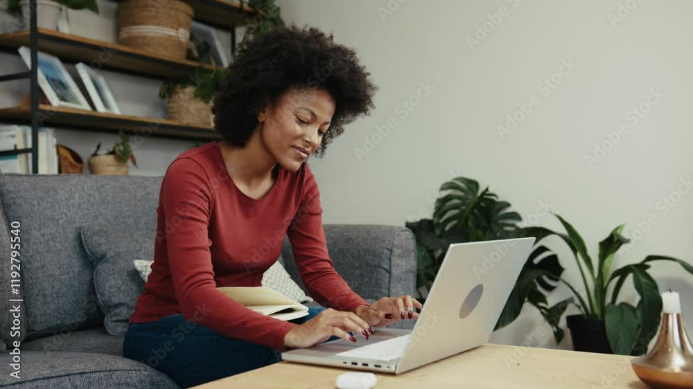 African American university teacher setting up an assignment for her students on a laptop African American university teacher setting up an assignment for her students on a laptop