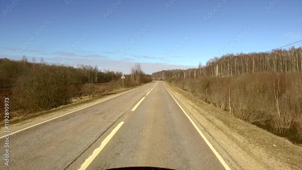 Road with a few trees in the background Road with a few trees in the background