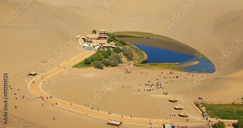 Time lapse of Dunhuang Crescent Spring and Singing Sand Mountain.Dunhuang Crescent Spring is located in the ring of the sand Mountain, because the shape of a curved crescent moon named.
