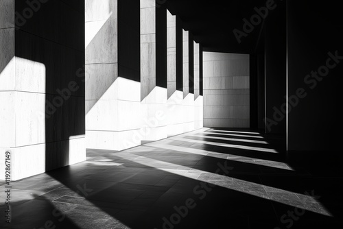 Light and shadow interplay in a minimalist architectural corridor during midday hours photo