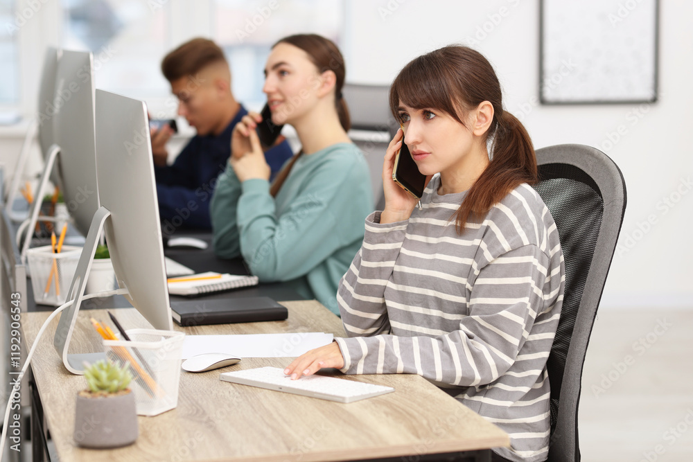 Sales department. People calling to clients in office, selective focus Sales department. People calling to clients in office, selective focus