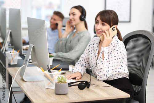 Sales department. People calling to clients in office, selective focus