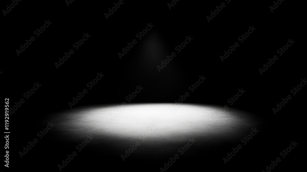 Spotlight illuminating a dark surface.