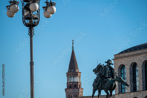 Statue of Vittorio Emanuele II in Piazza del Duomo in Milan. Monument to the first king of Italy. View of the Arengario, the Museum of the Twentieth Century and the Bell Tower of the Hours