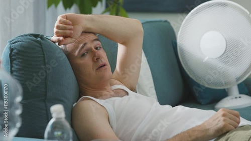 Exhausted man suffering from the heat
