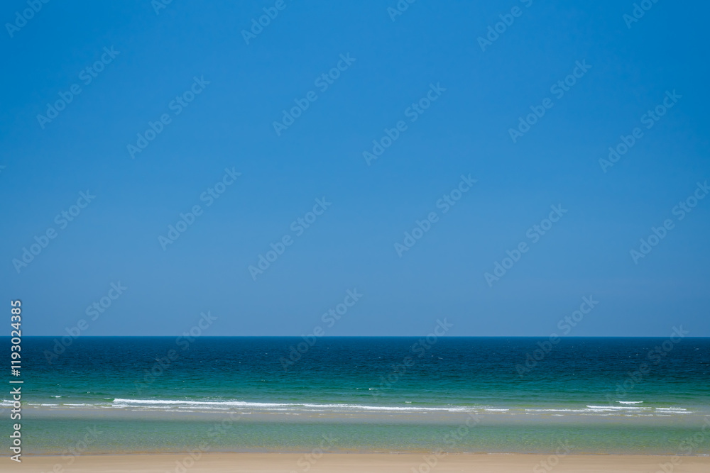 Beautiful seascape with blue sky on a sunny day. Nature background. Sea surface in sun light. Relaxing natural photo wallpaper. Teal blue ocean view. Breezy wavy seawater. Water background texture. Beautiful seascape with blue sky on a sunny day. Nature background. Sea surface in sun light. Relaxing natural photo wallpaper. Teal blue ocean view. Breezy wavy seawater. Water background texture.