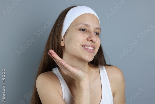 Wallpaper Mural Teenage girl with acne problem on grey background Torontodigital.ca
