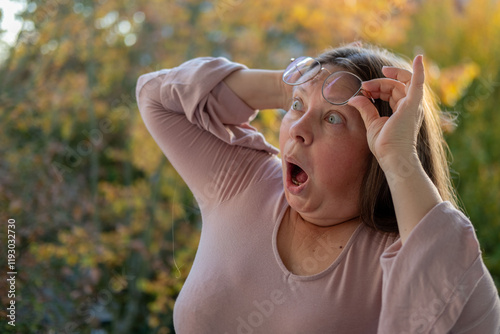 middle-aged woman stunned by shocking news, emotional funny portrait freak, showing deep surprise and emotional reaction